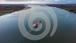 A cargo ship sailing down the River Orwell in Suffolk