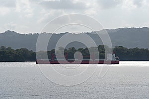 Cargo ship sailing through Gatun Lake, Panama Canal.