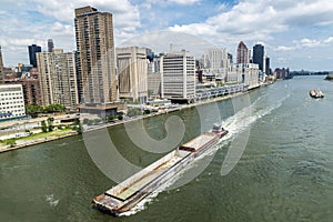 Cargo ship sailing in New York City, USA