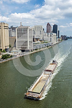 Cargo ship sailing in New York City, USA