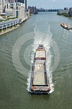 Cargo ship sailing in New York City, USA