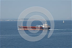 Cargo ship sailing at open sea