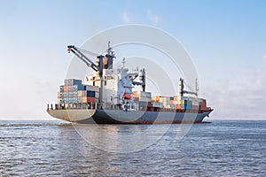 Cargo ship is sailing to sea to transport cargo in containers.Logistics and transportation of International