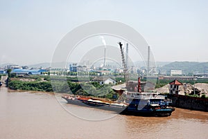 Cargo ship with sand at the bank of Yangtze river