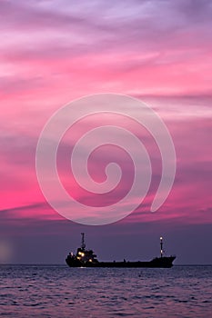 Cargo ship in South China Sea at dusk, Vietnam