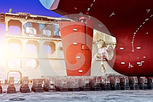 Propeller with rudder Close up and Repair Cargo ship in floating dry dock.