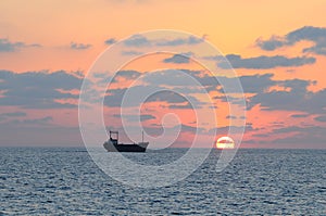 Cargo ship and sunset.