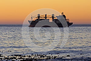 Cargo ship at sunset