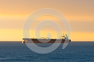 Cargo ship at sunset in the coasts of Chile