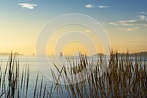 Cargo ship at sunset in the sea