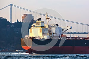 Cargo ship tanker in Bosphorus Strait about to pass under Bosphorus bridge