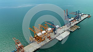 cargo ship and truck at seaport waiting for container dock by crane shipment harbor loading container import export commercial