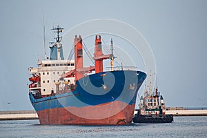 Cargo ship and tug boat