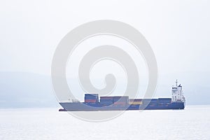 Cargo ship vessel freight containers carrier transport on sea ocean to port dock