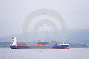 Cargo ship vessel freight containers carrier transport on sea ocean to port dock