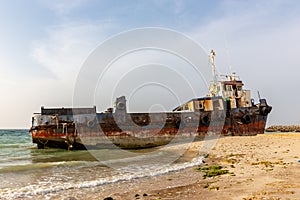 Cargo ship wreck run aground on the Al Hamriyah beach in Umm Al Quwain, United Arab Emirates