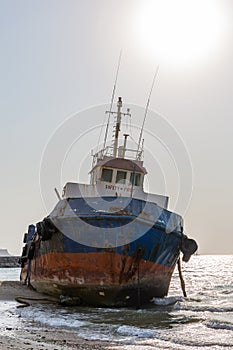 Cargo ship wreck washed ashore on the Al Hamriyah beach in Umm Al Quwain, United Arab Emirates