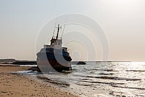 Cargo ship wreck washed ashore on the Al Hamriyah beach in Umm Al Quwain, United Arab Emirates