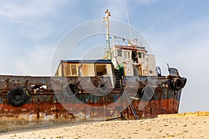 Cargo ship wreck washed ashore on the Al Hamriyah beach in Umm Al Quwain, United Arab Emirates