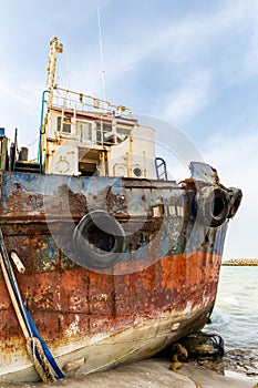 Cargo ship wreck washed ashore on the Al Hamriyah beach in Umm Al Quwain, United Arab Emirates