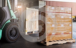Cargo shipment boxes. Industry freight truck and warehousing. Forklift loading cargo into shipping container. Logistics transport.