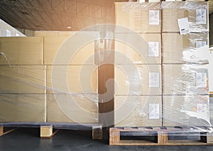 Cargo shipment boxes, Manufacturing and warehousing. Stacked of package on pallet at storage warehouse.