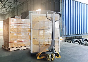 Cargo shipment loading for truck. Freight truck for delivery service. Warehouse dock load pallet goods into container truck.