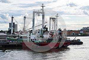 Cargo Ships anchored in Chao Phraya River, Bangkok, Thailand