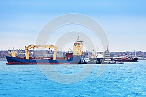 Cargo ships anchored at terminal of maritime port photo