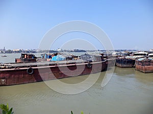 Cargo ships and boats dockyard or harbor and port on The Ganges river