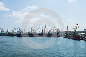 Cargo ships and cranes in the seaport