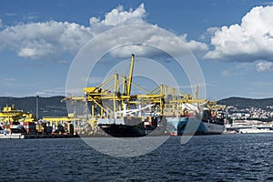 Cargo ships docked at Pier VII of the Port of Trieste loading:unloading containers