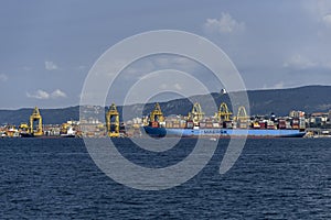Cargo ships docked at Pier VII of the Port of Trieste loading:unloading containers
