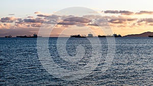 Cargo ships moored in harbor