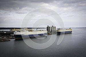 Cargo ships moored at a large European dock