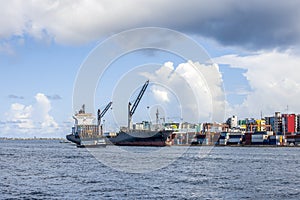 Cargo ships in the port of Male city, the capital of the Republic of Maldives located on an island in the Indian ocean