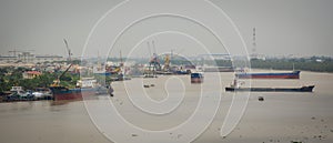 Cargo ships on the river in Haiphong, Vietnam