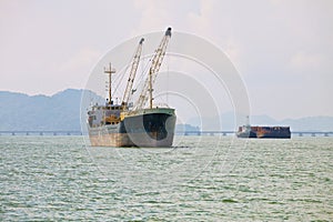 Cargo ships sailing across the sea. Conceptual image