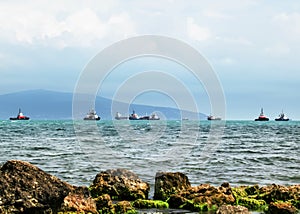 Cargo ships and tugs in the Black Sea, Russia