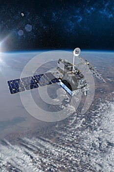 Cargo space craft and Earth planet. Dark background. Sci-fi wallpaper.Space Station Orbiting Earth.Space ship. Space art wallpaper