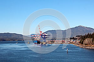 Cargo terminal for loading bulk cargoes woodpellets and containers by coastal cranes. Port Prince Ruppert BC, Canada. photo