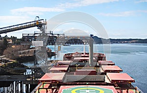 Cargo terminal for loading bulk cargoes woodpellets and containers by coastal cranes. Port Prince Ruppert BC, Canada. photo