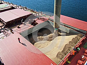 Cargo terminal for loading bulk cargoes woodpellets and containers by coastal cranes. Port Prince Ruppert BC, Canada. photo