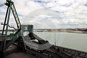 Cargo terminal for loading coal cargos by shore cranes. Port Gladstone, Australia. December, 2019.