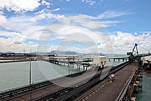 Cargo terminal for loading coal cargos by shore cranes. Port Gladstone, Australia. December, 2019.