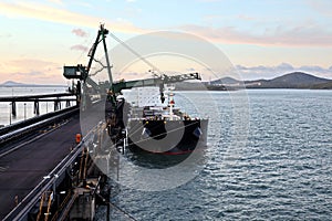 Cargo terminal for loading coal cargos by shore cranes. Port Gladstone, Australia. December, 2019.