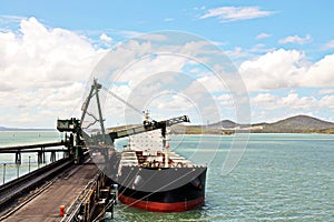 Cargo terminal for loading coal cargos by shore cranes. Port Gladstone, Australia. December, 2019.