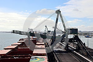 Cargo terminal for loading coal cargos by shore cranes. Port Gladstone, Australia. December, 2019. photo