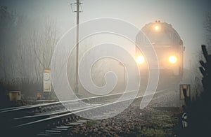 Cargo train emerging from the mist