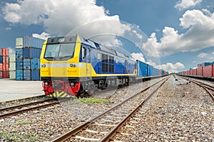Cargo train platform with freight train container at depot in po